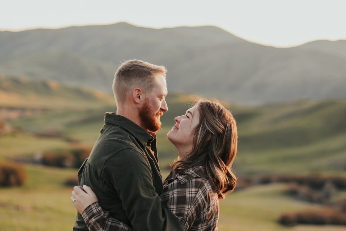 Couple Holding Each Other and Looking in the Eyes 